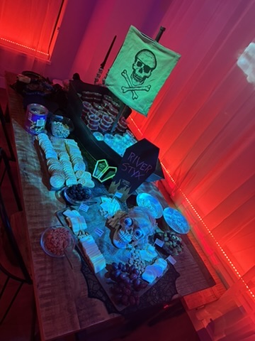 Glassware, skull motifs, and details arranged across the table.