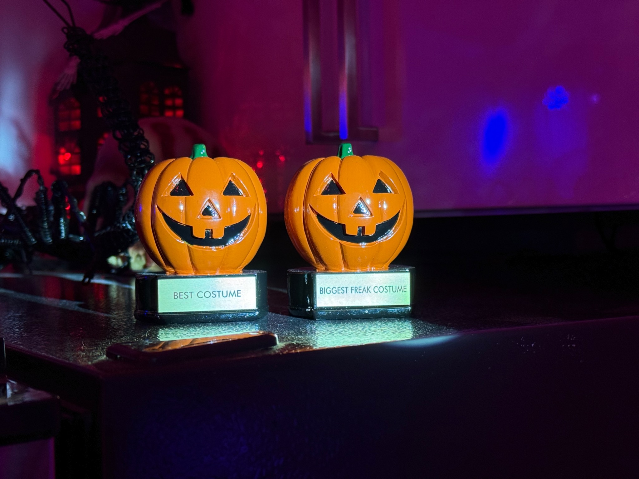Two jack-o’-lantern trophies on display.