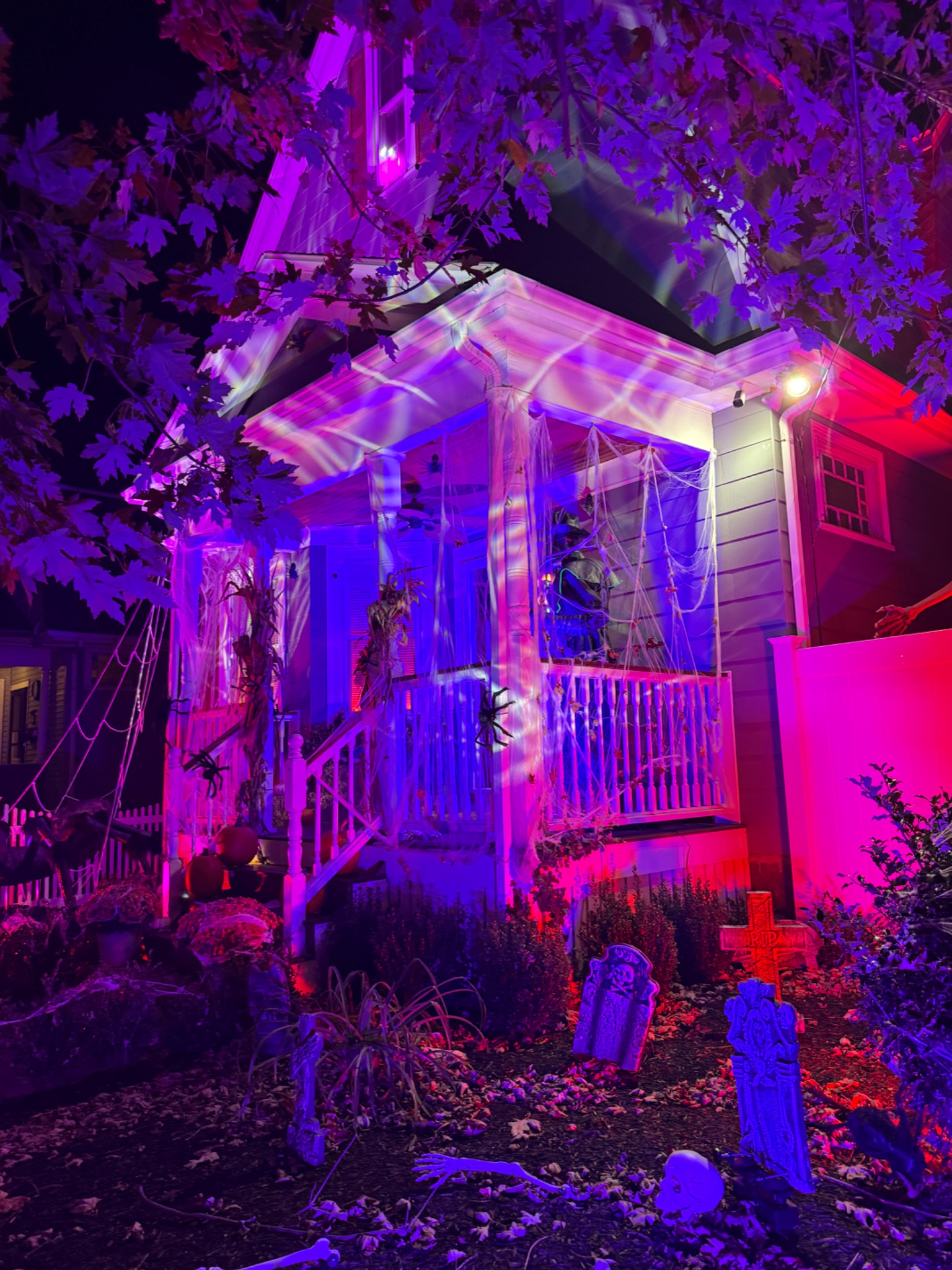 Violet and red lighting around the porch.