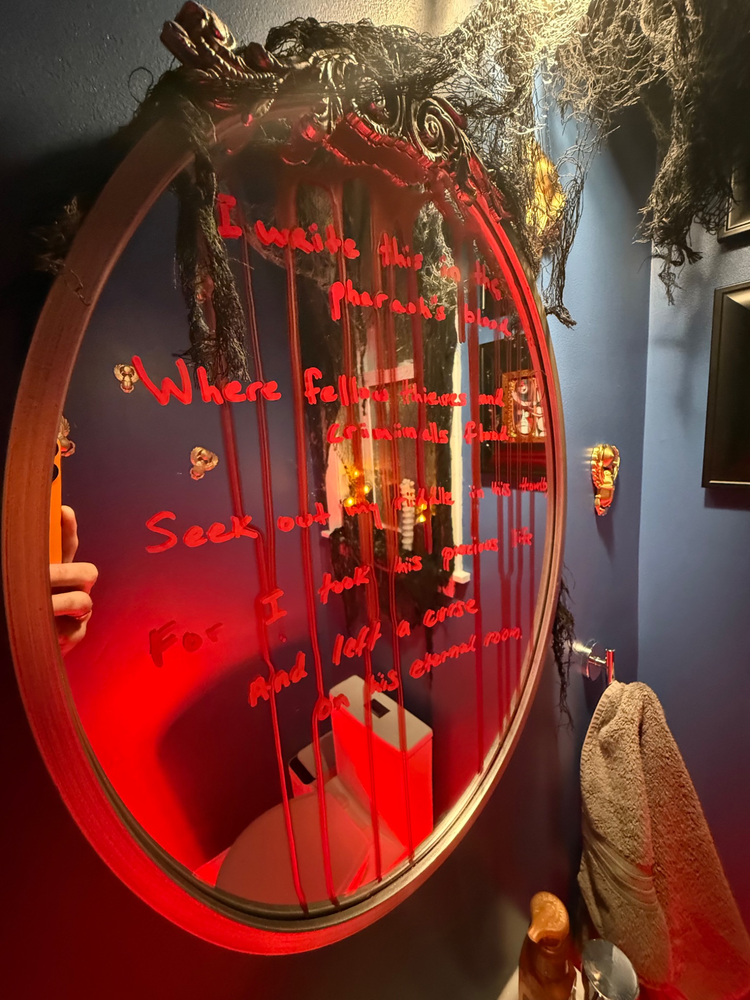 The first riddle, written in red across the bathroom mirror.