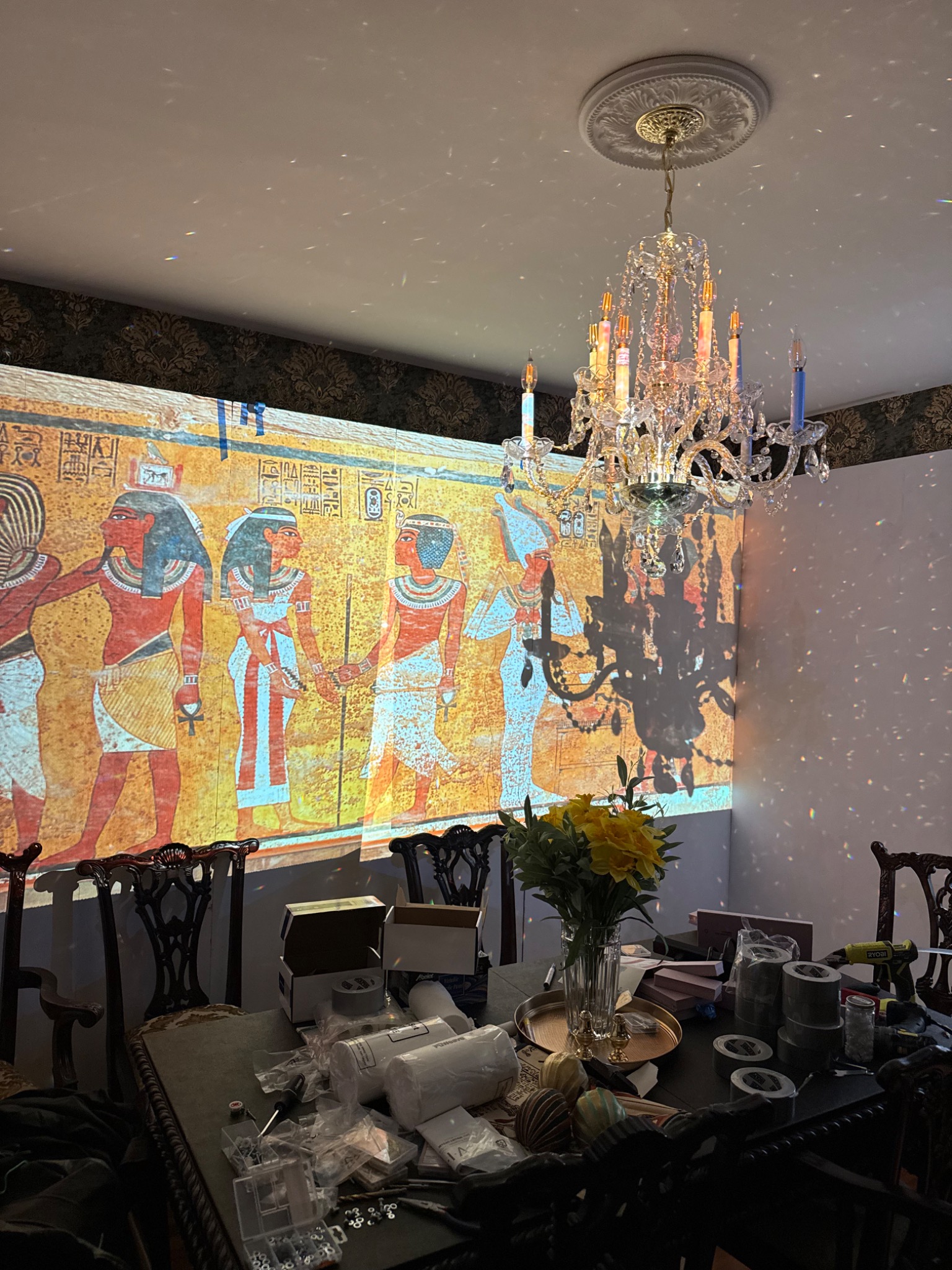 Testing Egyptian imagery across the dining-room walls.