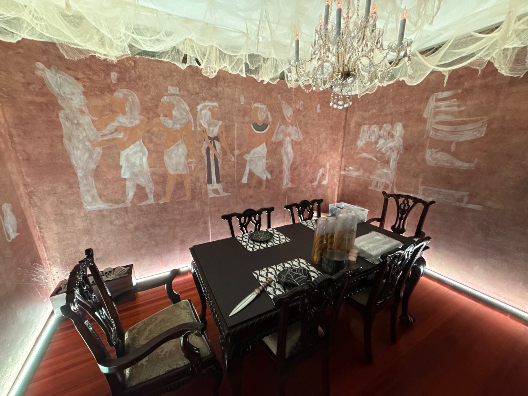 Textured walls, ceiling gauze, and projections as the room takes shape.